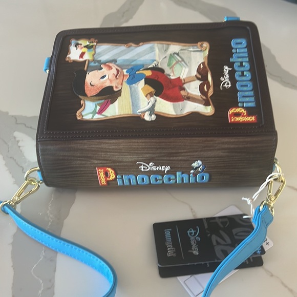 Loungefly Pinocchio Storybook Crossbody/Backpack - Picture 2 of 11